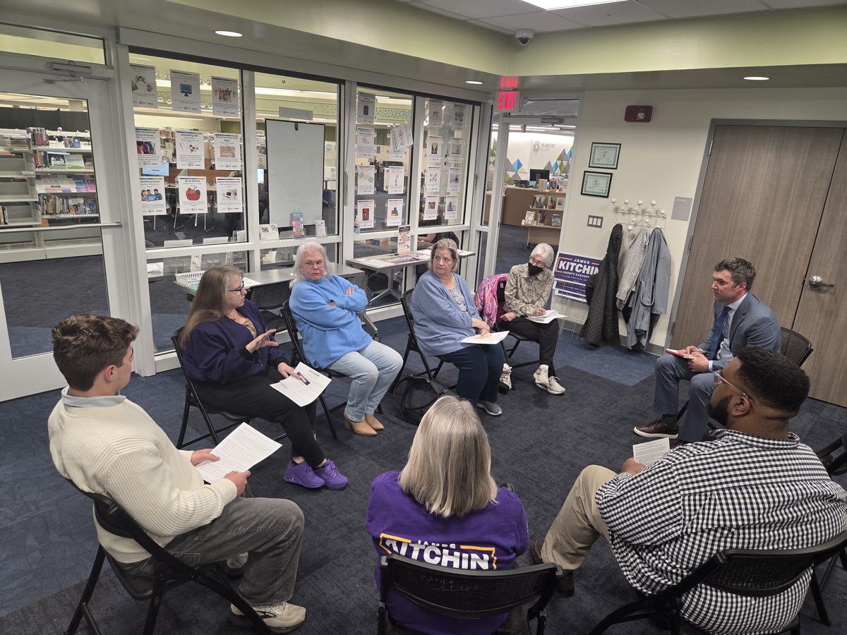 James in a listening session circle at the library