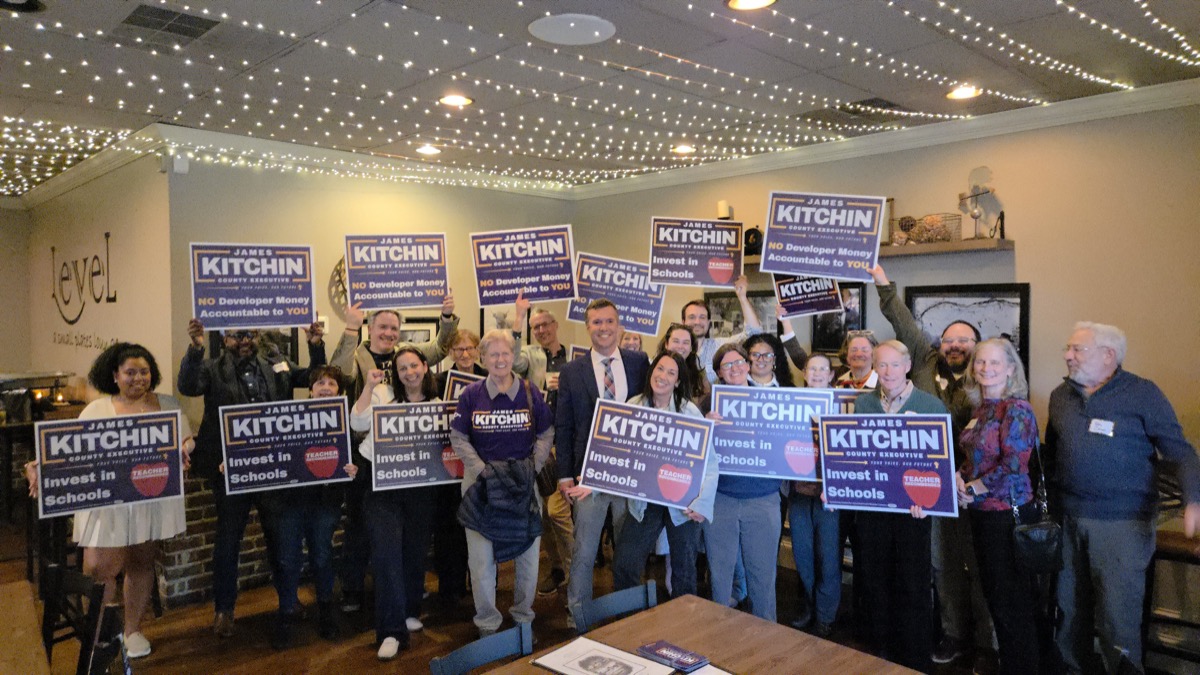 Supporters holding Kitchin signs at campaign rally