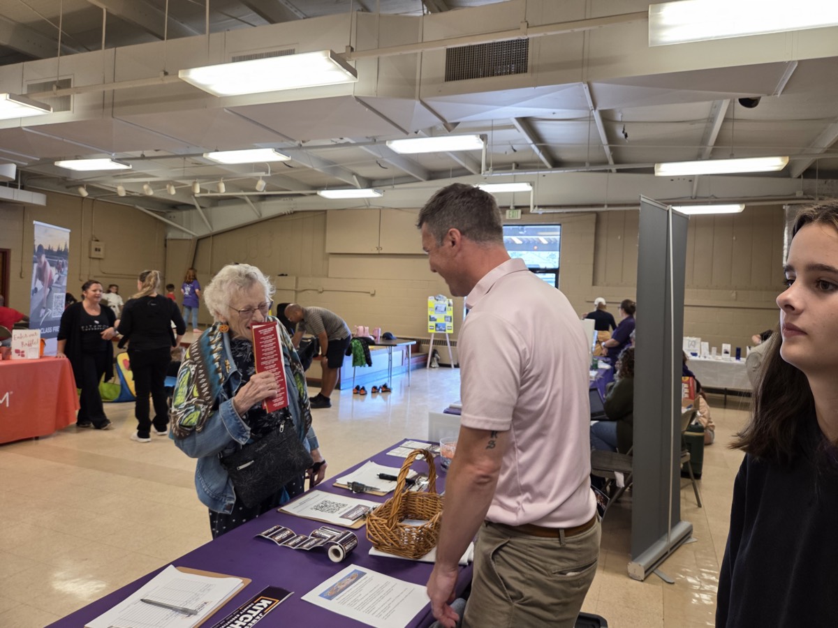 James connecting with voters at a community fair