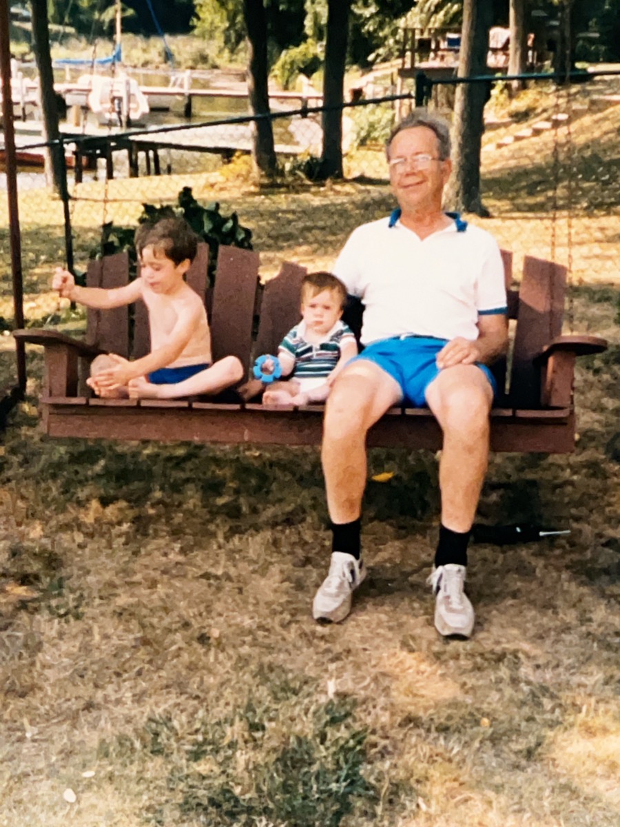 James as a child with his grandfather on a porch swing