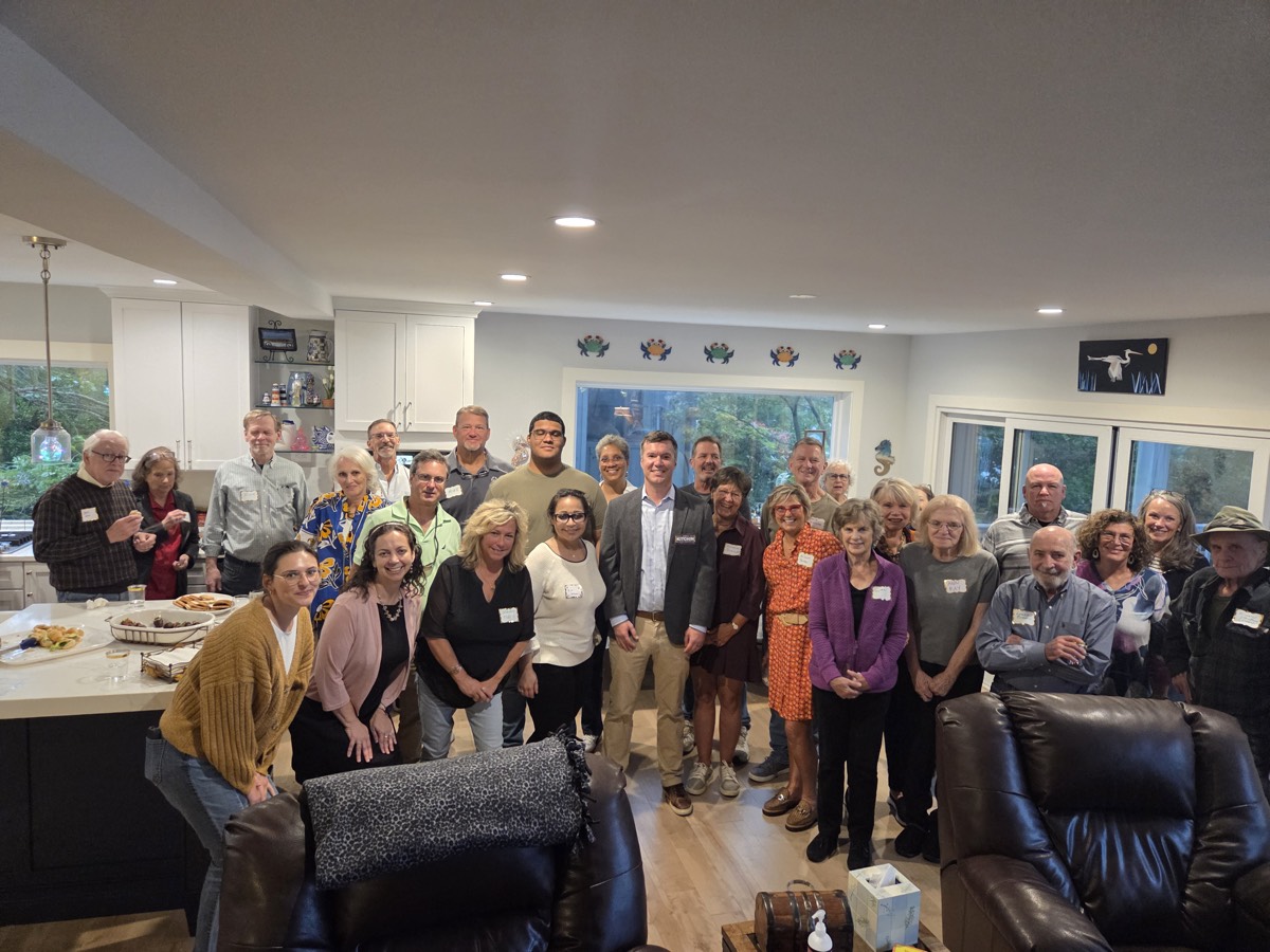 Group photo with supporters at a house party