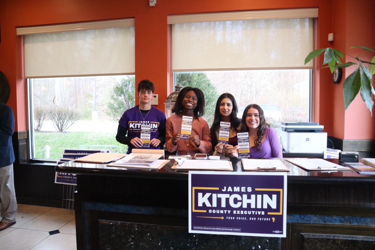 Campaign fellows at headquarters with signs