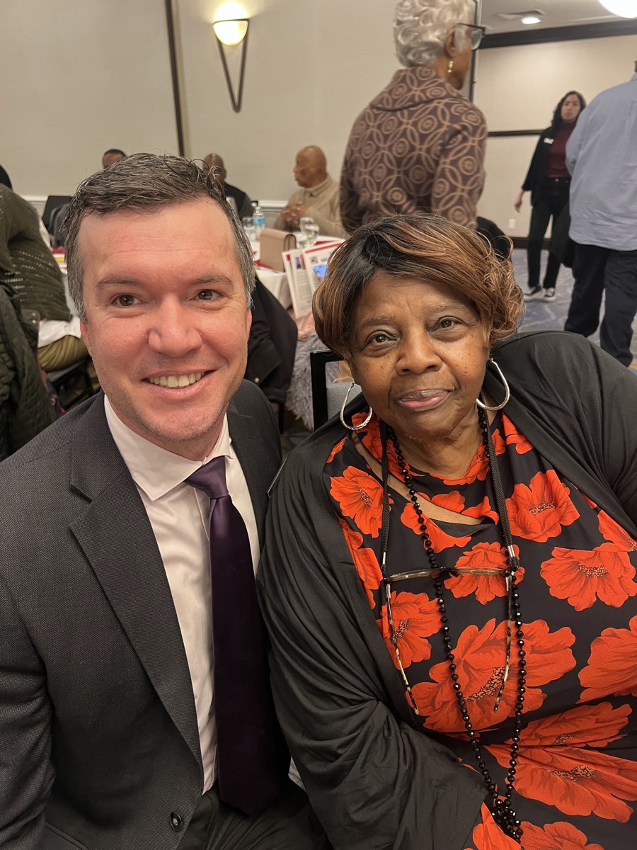 James with community leader at gala event
